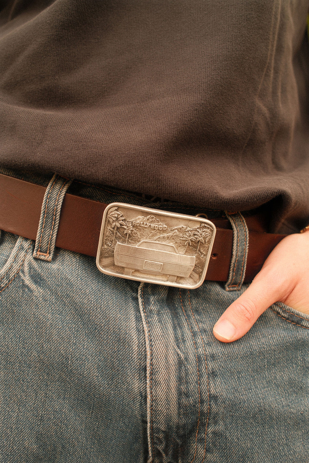 Man wearing a brown caballero belt with the Caballero hollywood buckle