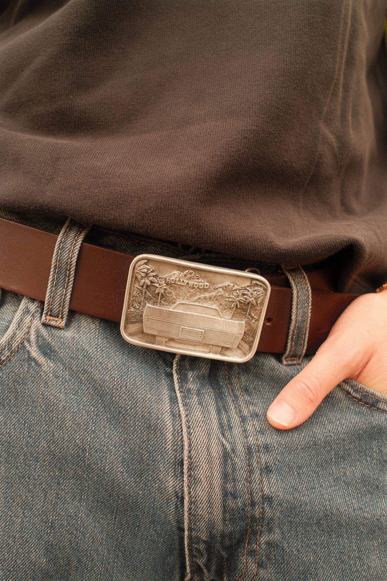 Man wearing a brown caballero belt with the Caballero hollywood buckle
