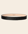 Caballero Black leather stitched belt on a beige background