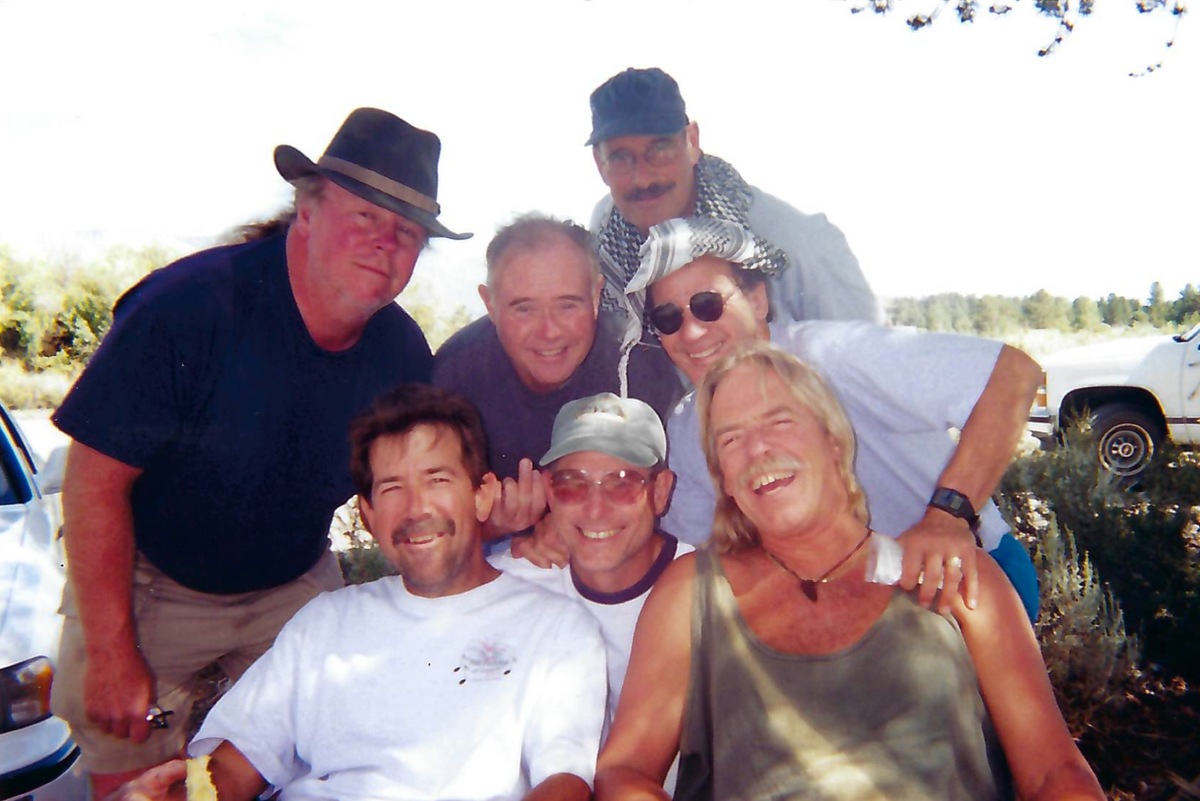 Group of men, the caballeros posing outdoors with nature in the background